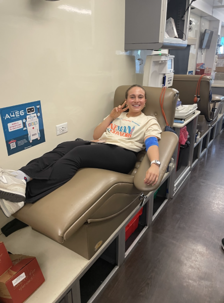 Senior Madison Mintz gets her blood drawn in a Carter BloodCare truck.